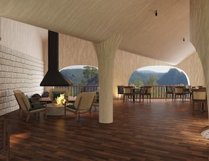 A spacious interior with a fireplace, seating area, and a view of the outdoors.