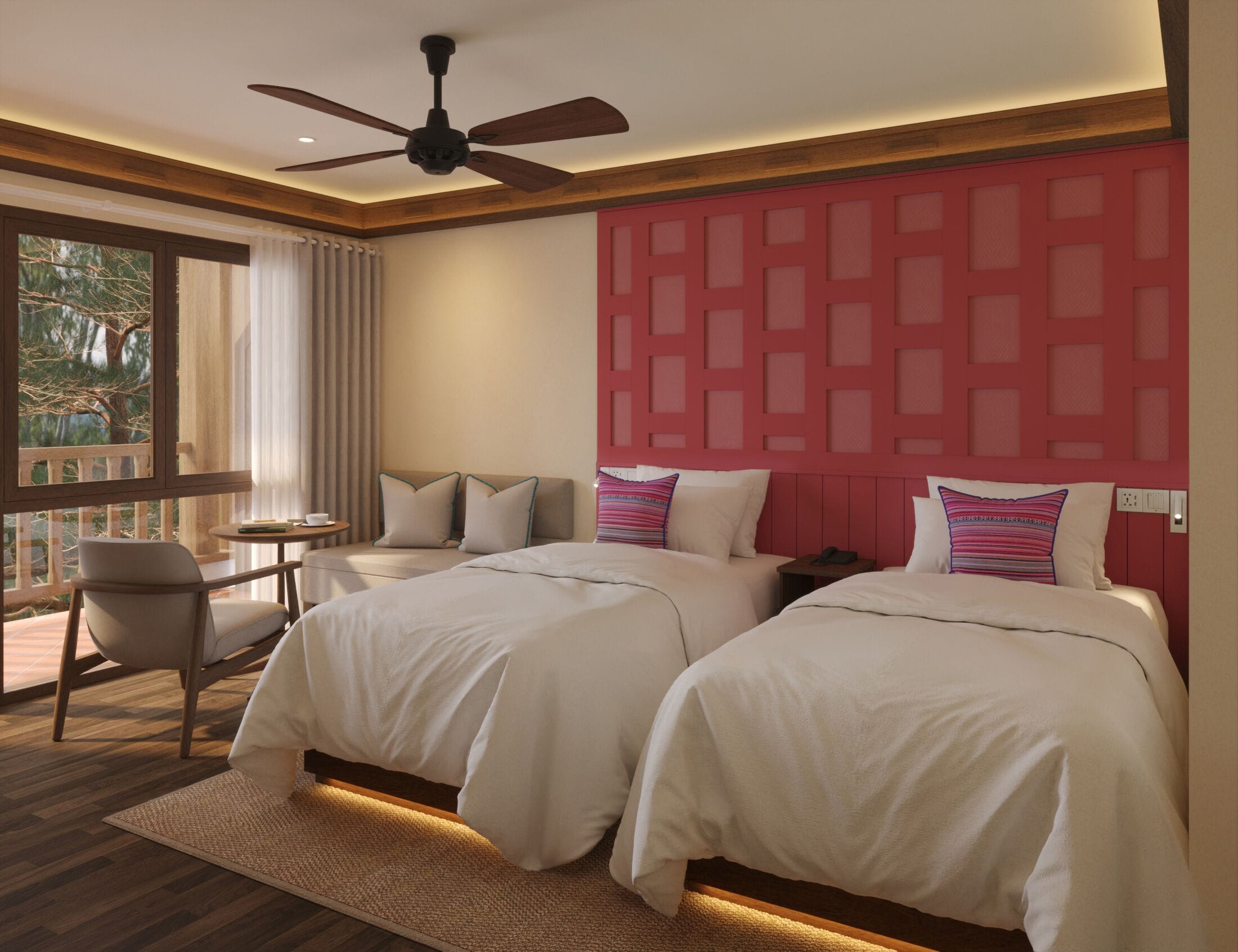 Habitación de hotel con dos camas, un ventilador de techo, una mesita con una silla y vistas a árboles por la ventana.