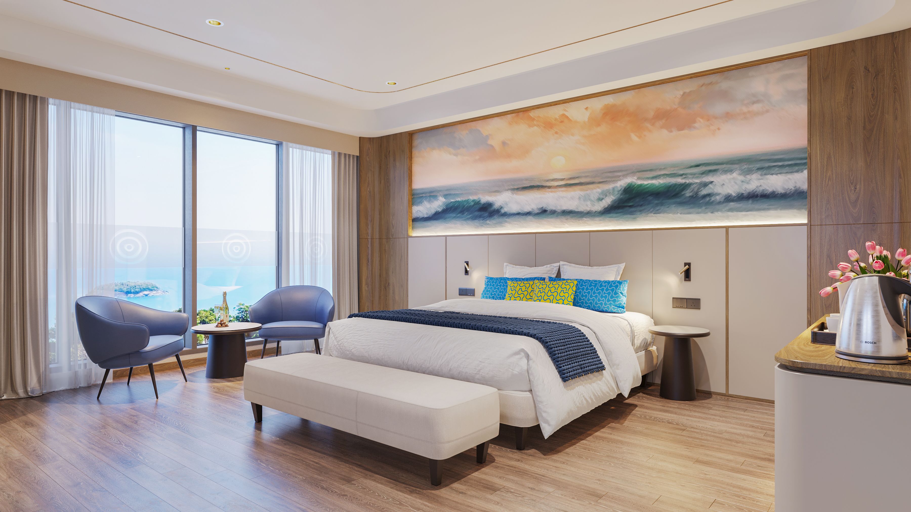 A modern hotel room with a large bed, a seating area with two chairs, a view of the ocean through large windows, and a painting of waves on the wall.