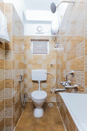 A bathroom with a toilet, sink, and shower. - City Haven by Jadecaps 3bhk South Kolkata (Kolkata)