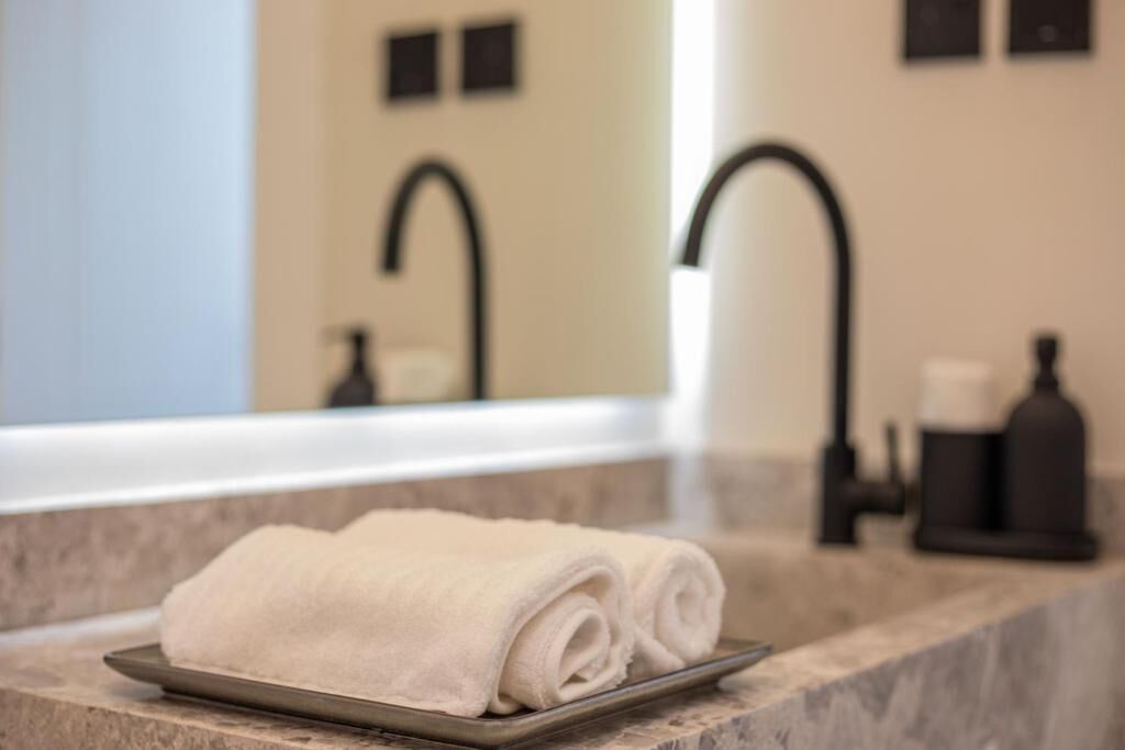 Shower, hair dryer, slippers, towels