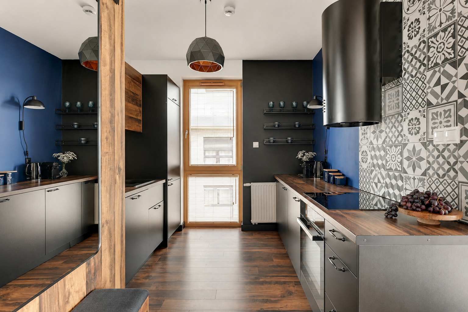 A modern kitchen with a central island, wooden accents, and patterned backsplash.