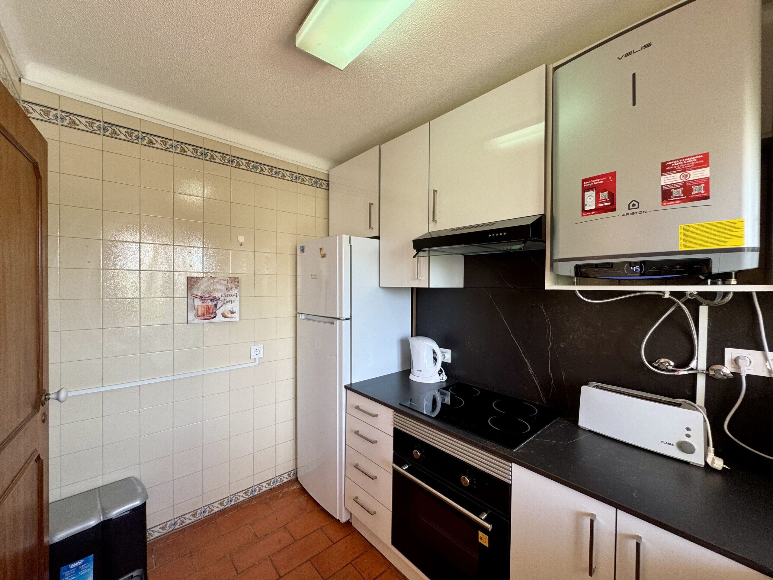 Coffee/tea maker, fridge, microwave, oven