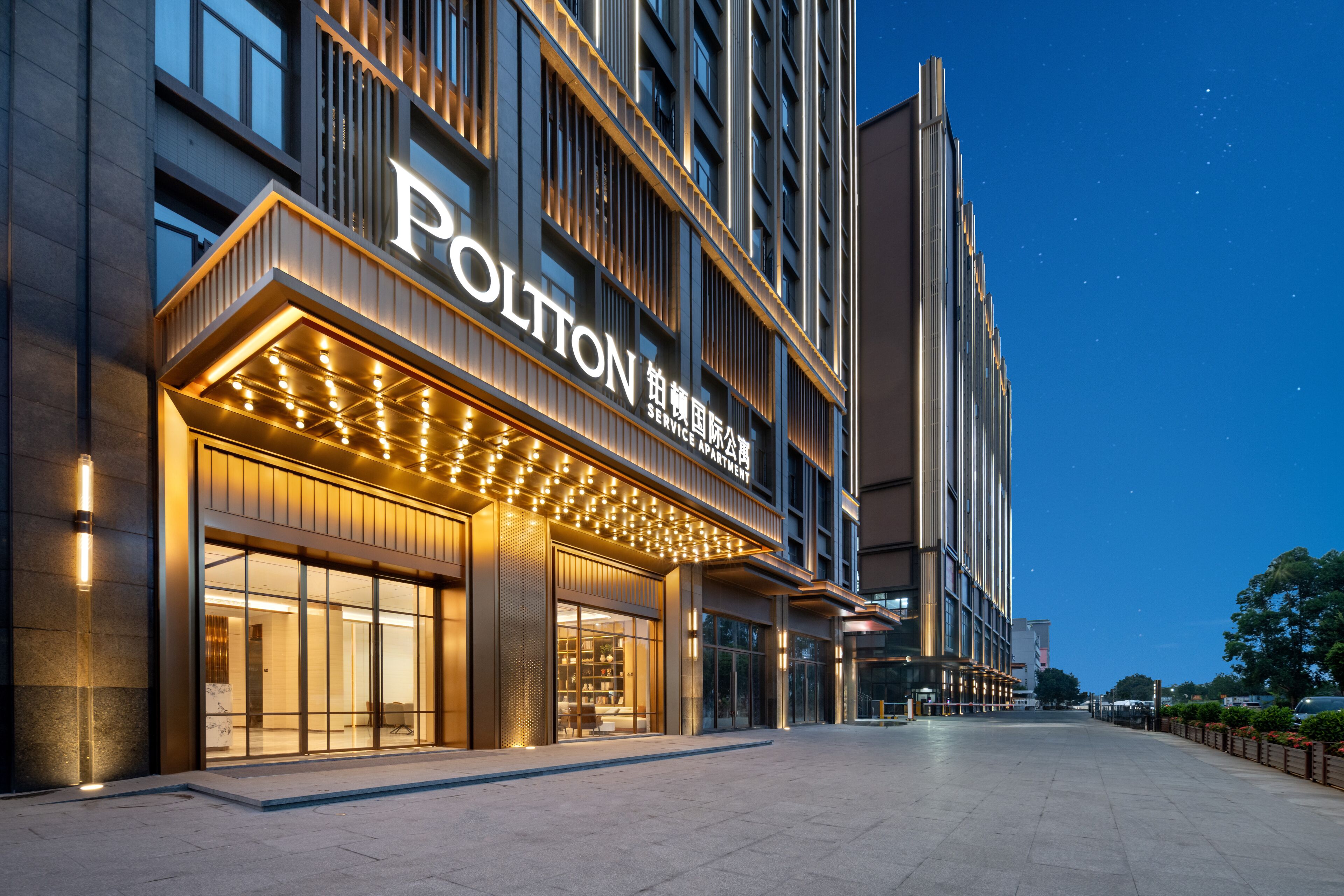 A modern building with a prominent sign reading 'POLTON SERVICE APARTMENT'.