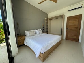 A bedroom with a large bed, a wardrobe, a nightstand, and a ceiling fan. - Villa Ramay - Boutique Pool Villa - 5 Minutes to Fisherman's Village (Amphoe Ko Samui)
