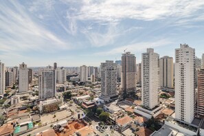 A high-rise urban area with multiple buildings, including a construction site and residential structures. - Studio With Balcony in Condo With Pool - Wbu2615 (Goiânia)