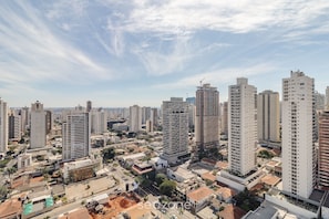 A high-rise urban area with multiple buildings, including a construction site and residential structures. - Studio With Balcony in Condo With Pool - Wbu2615 (Goiânia)