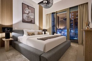 A modern hotel room with a large bed, a city view, and a contemporary design. - Premium 1BR in Grande | Heart of Downtown Dubai (Dubai)