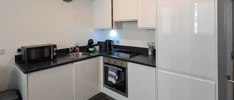 Coffee/tea maker, fridge, microwave, oven