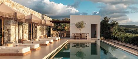 Seasonal outdoor pool, open 7:00 AM to 11:00 PM, pool umbrellas
