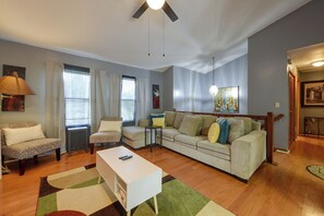A living room with a sofa, armchairs, a coffee table, and a TV. - 16 Mi to Dtwn Charleston! Backyard Retreat w/ Deck (North Charleston)