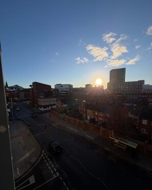 A cityscape with buildings and a road during daylight. - Stylish 2-Bed w/ Balcony | City Centre (Liverpool)