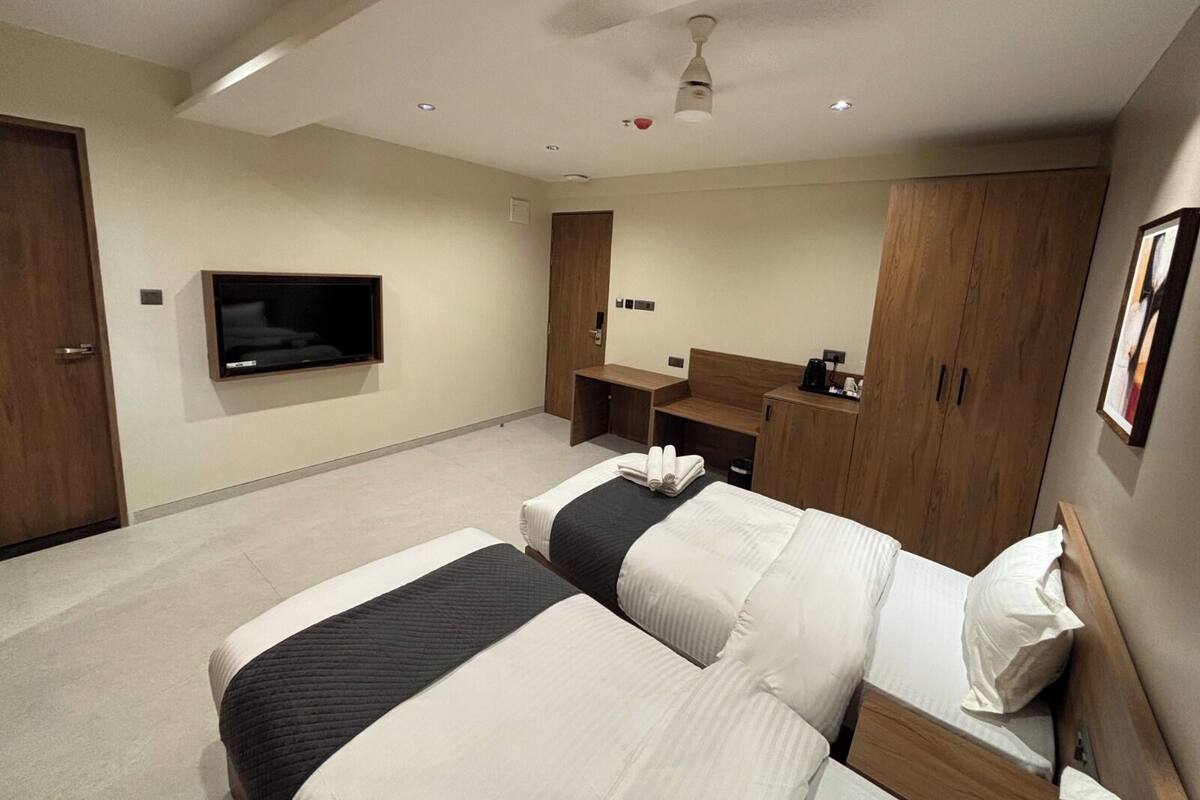 Family Room, City View | Desk, laptop workspace, free WiFi