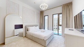 A modern hotel room with a large bed, a desk, a TV, and a balcony with a view of the city. - Aesthetic 2 Bed in Townsquare l Pool and Gym (Town Square)