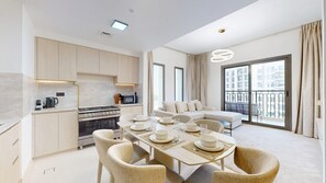 A modern apartment with a dining area, kitchen, and a balcony with a view. - Aesthetic 2 Bed in Townsquare l Pool and Gym (Town Square)