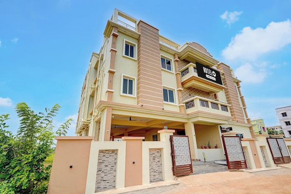 A multi-story hotel with a prominent sign, balconies, and a gated entrance. - Hotel O AIIMS Bhubaneshwar (Bhubaneshwar)