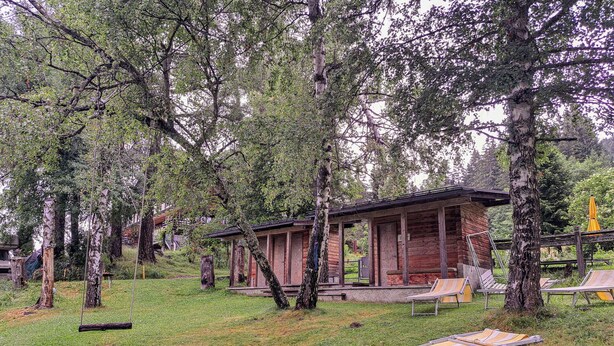 A rustic cabin with a porch, surrounded by trees and grass. - Wonderful private villa for 17 guests with WIFI, TV and terrace (Pill)