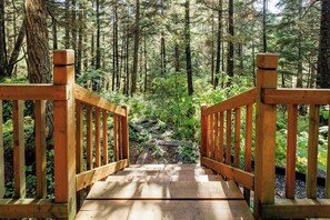 A wooden staircase leading into a forested area. - Lodge-style Chalet w/ Hot Tub Near Alyeska (Girdwood)