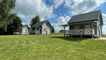 A residential property with two houses, each with a porch and a covered area.
