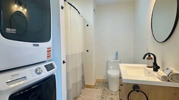 Shower, hair dryer, towels