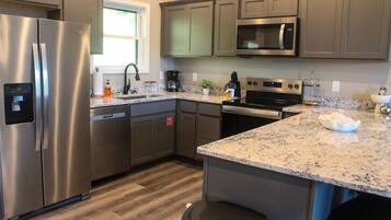 Coffee/tea maker, fridge, microwave, oven