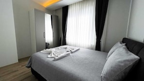 Family Apartment, 1 Bedroom, Kitchenette, City View | Laptop workspace, iron/ironing board, WiFi (free)