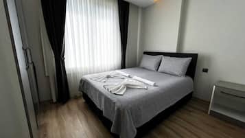 Family Apartment, 1 Bedroom, Kitchenette, City View | Laptop workspace, iron/ironing board, WiFi (free)