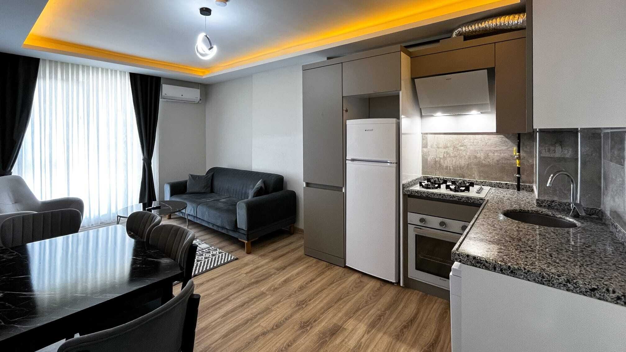 Full-sized fridge, stovetop, dishwasher, cookware/dishes/utensils