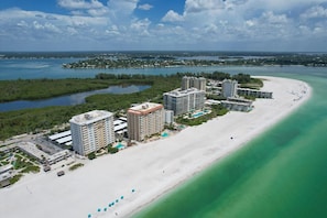 A coastal resort with beachfront villas, a sandy beach, and clear turquoise waters. - Siesta Key 239 - Two Bedroom Apartment, Sleeps 6 (Siesta Key)