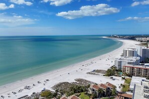 A coastal hotel with a beach view, multiple balconies, and a clear sky. - Siesta Key 236 - Two Bedroom Apartment, Sleeps 6 (Siesta Key)