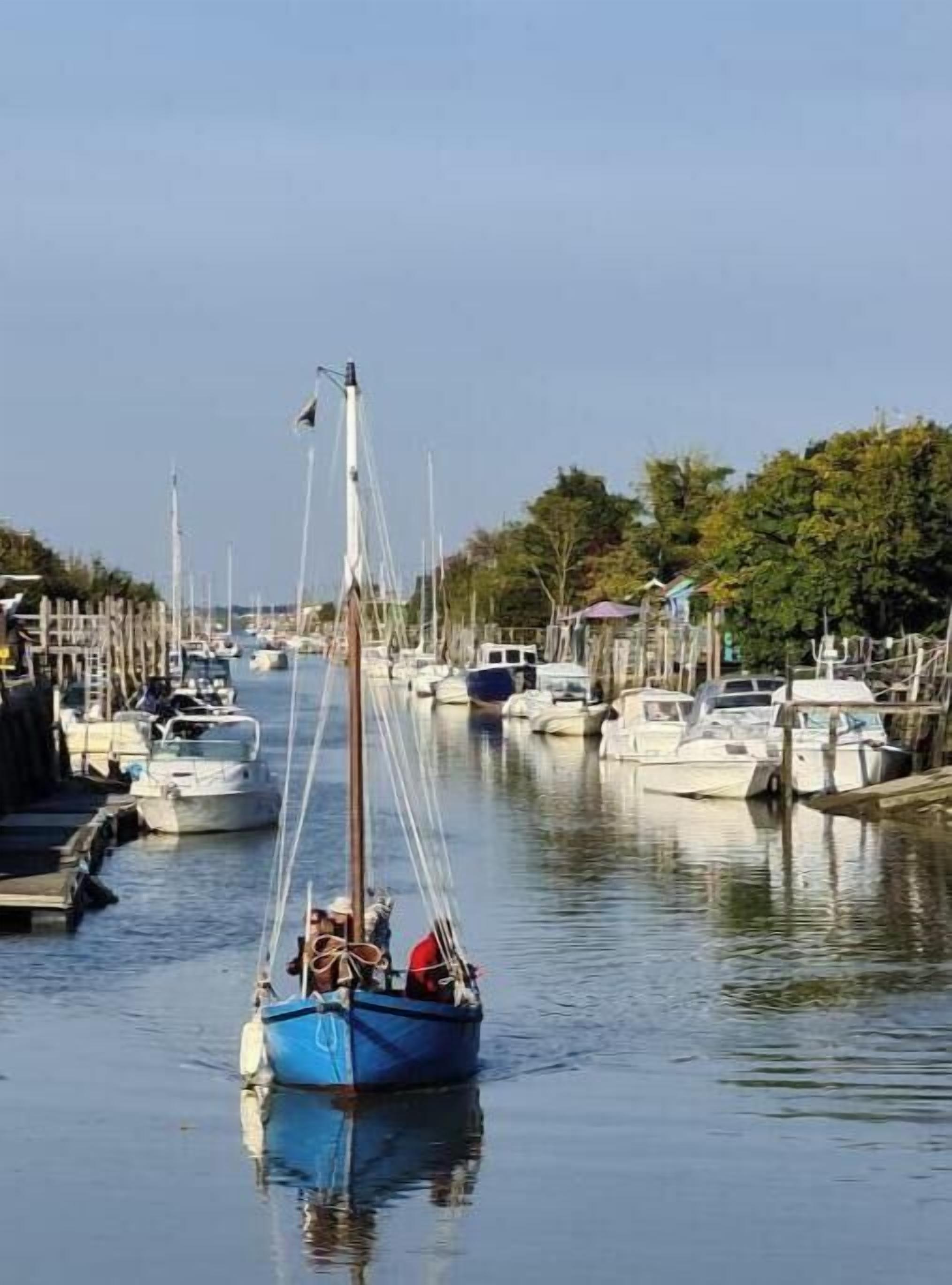 A marina with boats docked along the waterway.