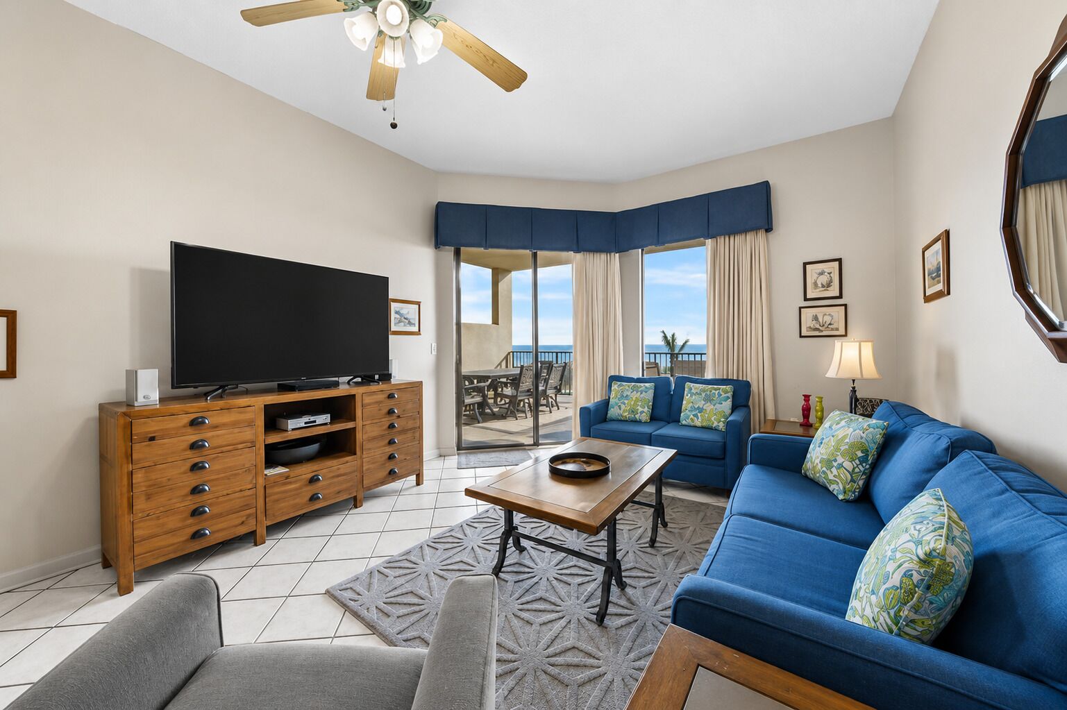 A living room with a television, sofa, and coffee table.
