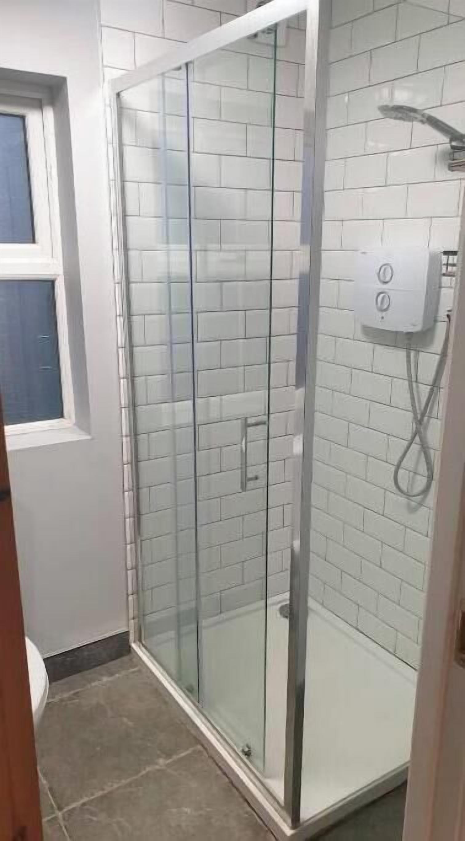 Shower, hair dryer, towels, toilet paper