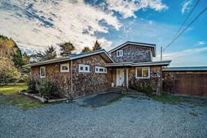 A two-story house with a front porch and a garage. - Seagull's Bluff - Scenic Coastal Retreat with Ocean Views (Trinidad)