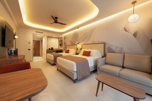 A modern hotel room with a bed, sofa, and a dining area. - Riu Palace Quintana Roo - Adults Only - All Inclusive (Punta Sam)
