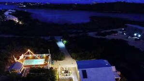 A residential property with a swimming pool, a tennis court, and a large house. - Lakeview House with Pool, BBQ, and Backyard (Venetian Road Settlement)