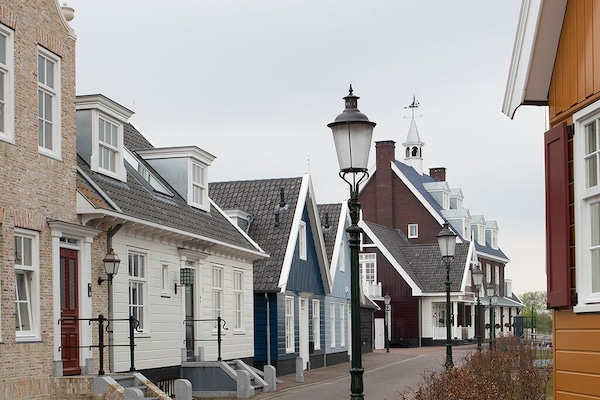 Stroll quiet lanes lined with colorful coastal cottages.