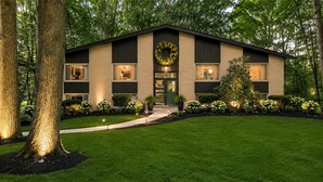 A modern two-story house with a well-maintained lawn and large trees. - The Woodlands Charity  -Large Private Room & bath in Tallmadge (Tallmadge)