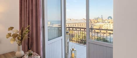 Family Quadruple Room, Balcony, City View | In-room safe, desk, laptop workspace, blackout drapes