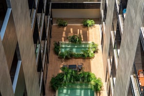 Unclassified image, 3 of 28, button - Musa del Carmen · Garden Patio & Pool Access (Playa del Carmen)