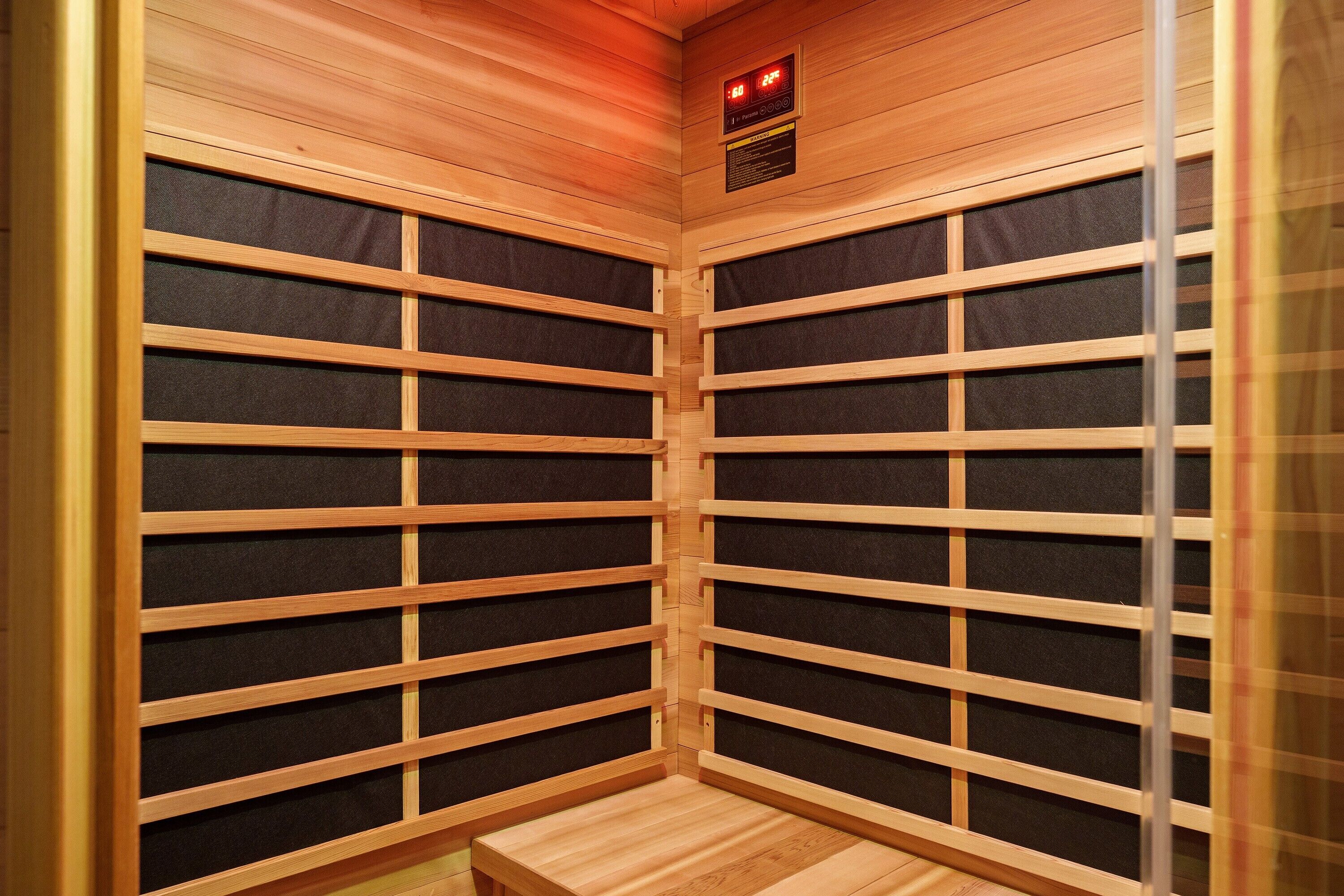 A sauna with wooden walls and a bench.