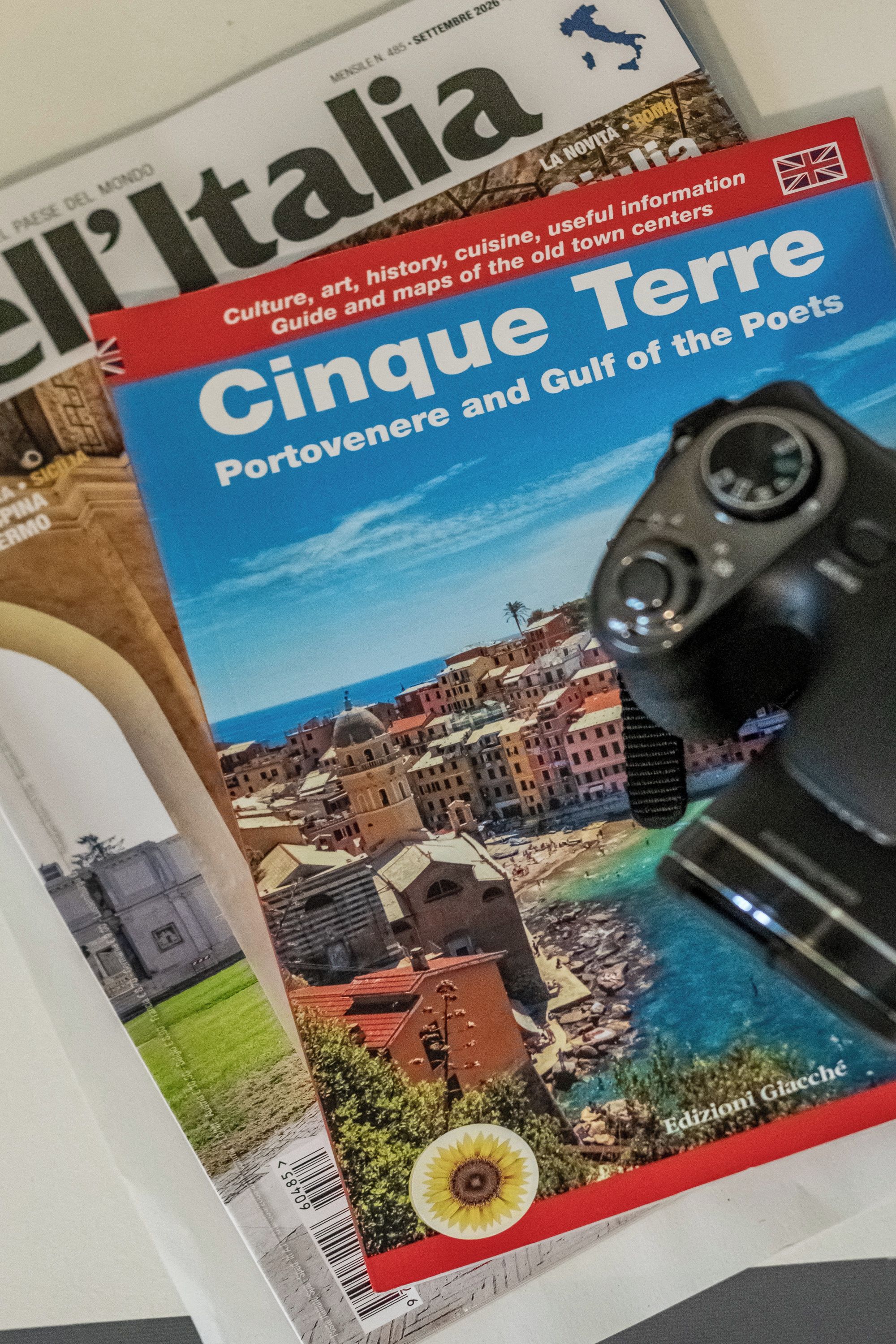A magazine cover with a cityscape and a camera.