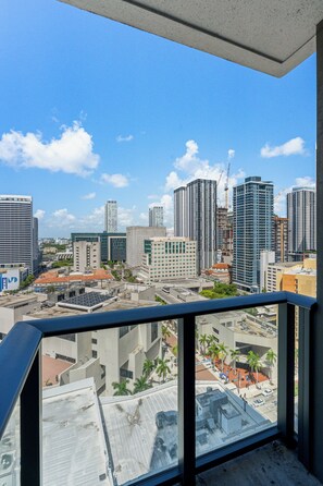 A high-rise building with a view of a cityscape, including other buildings and construction cranes. - 2-bedroom condo in marvelous Miami Views in the perfect spot! (Miami)