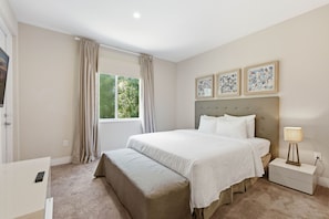 A bedroom with a bed, a nightstand, a lamp, a window with curtains, and artwork on the wall. - Stylish 4 Ensuite Home Near Disney, free BBQ grill (Four Corners)