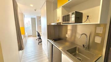Mini-fridge, microwave, stovetop, cookware/dishes/utensils