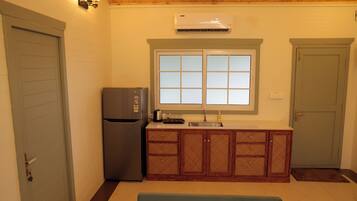 Executive Cottage, Garden View | Living area | LCD TV, printers
