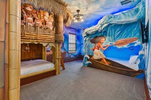 A room with a bunk bed, a mural of a girl in a boat, and a ceiling with a wave design. - The Gathering Spot - Six Bedroom House, Sleeps 14 (Lake Buena Vista)