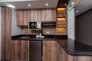 Suíte júnior, vista para a praia | Cozinha privada | Frigobar, micro-ondas, fogão