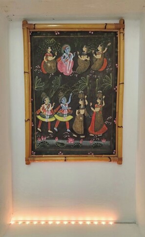 A framed artwork with a traditional scene, mounted on a wall. - Santa Fosca Cozy Apartment (venezia)