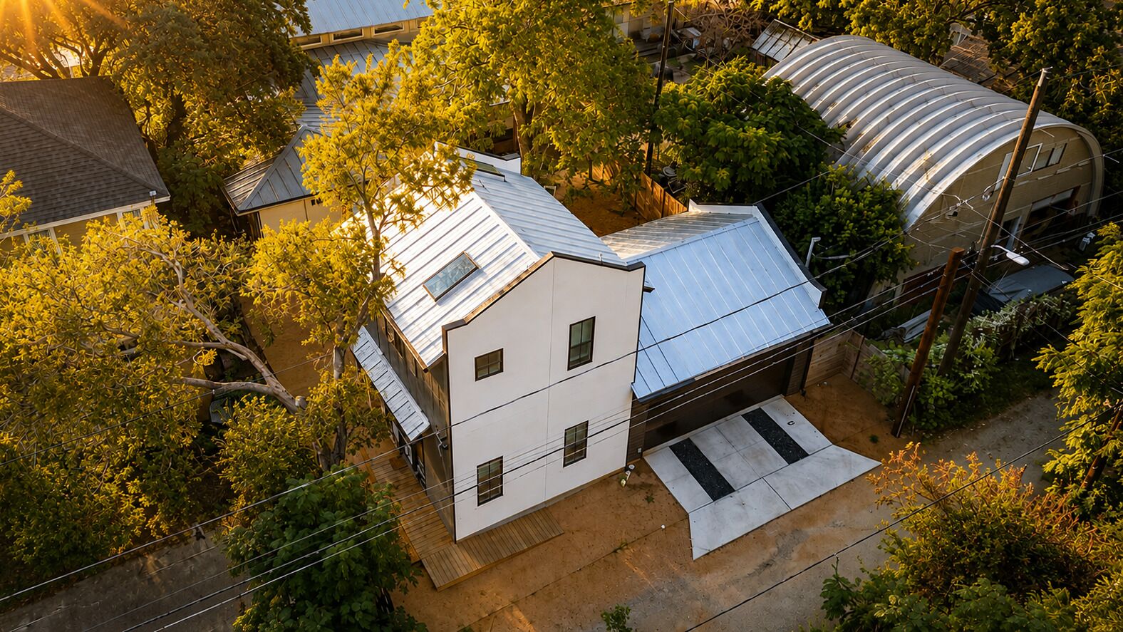 A residential building with a flat roof, a covered porch, and a garage.